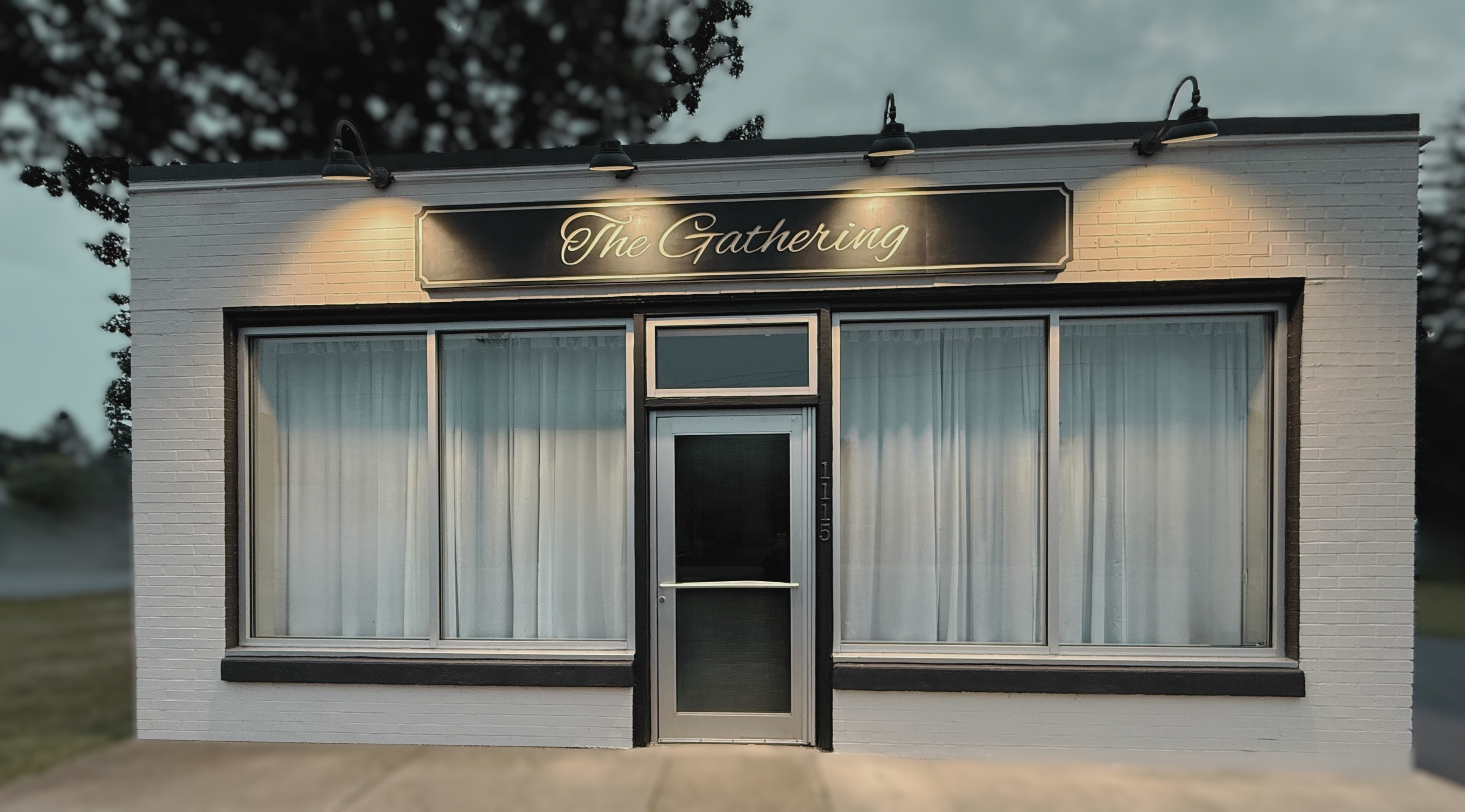 Exterior of The Gathering Olean with its illuminated venue sign